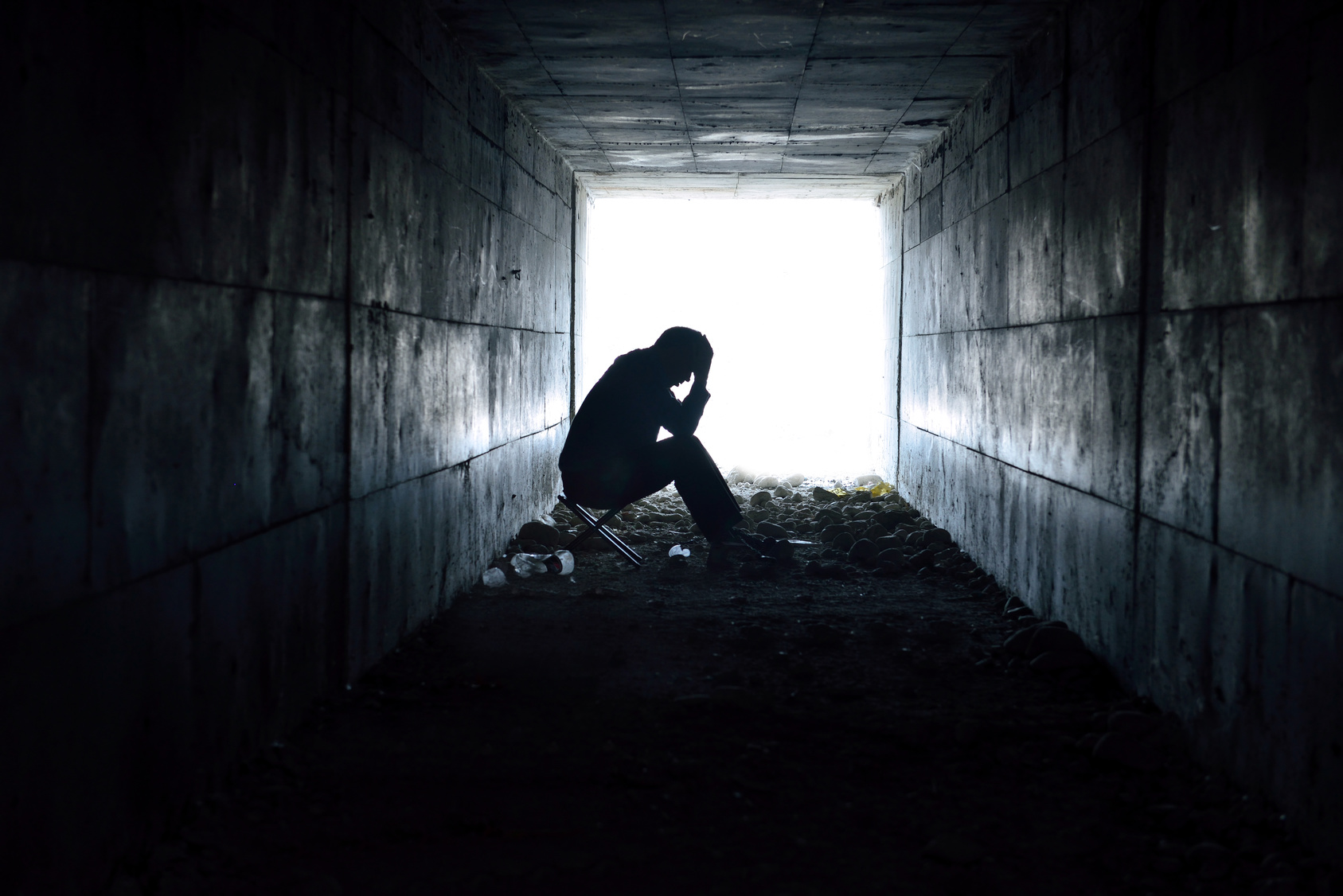 man sitting looking upset